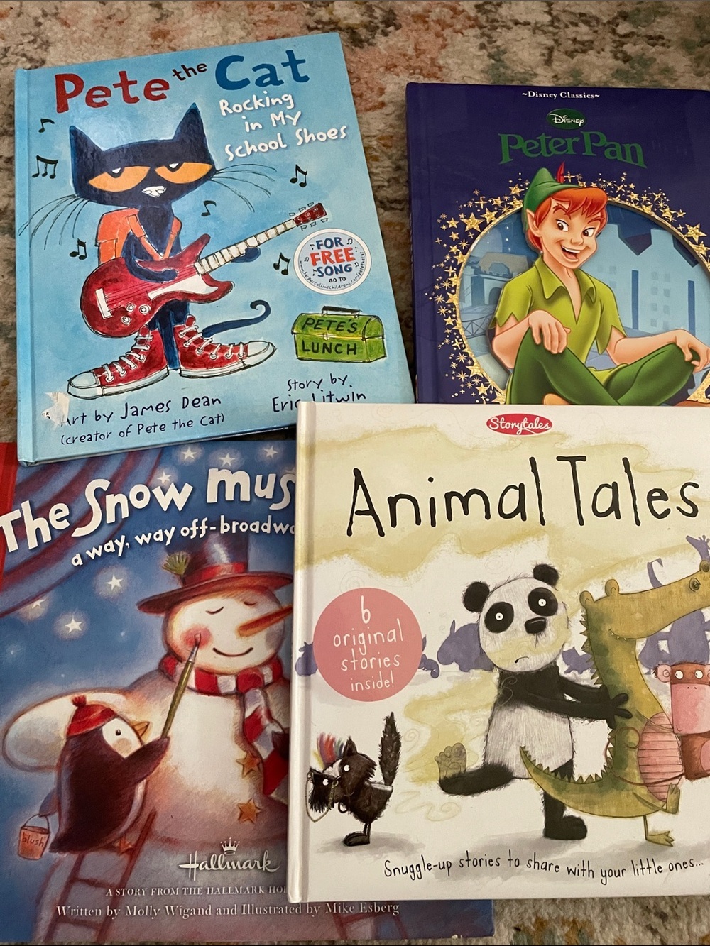 Children’s book lot of 4. Pete the Cat, Peter Pan, The Snow Must go On, Animal
